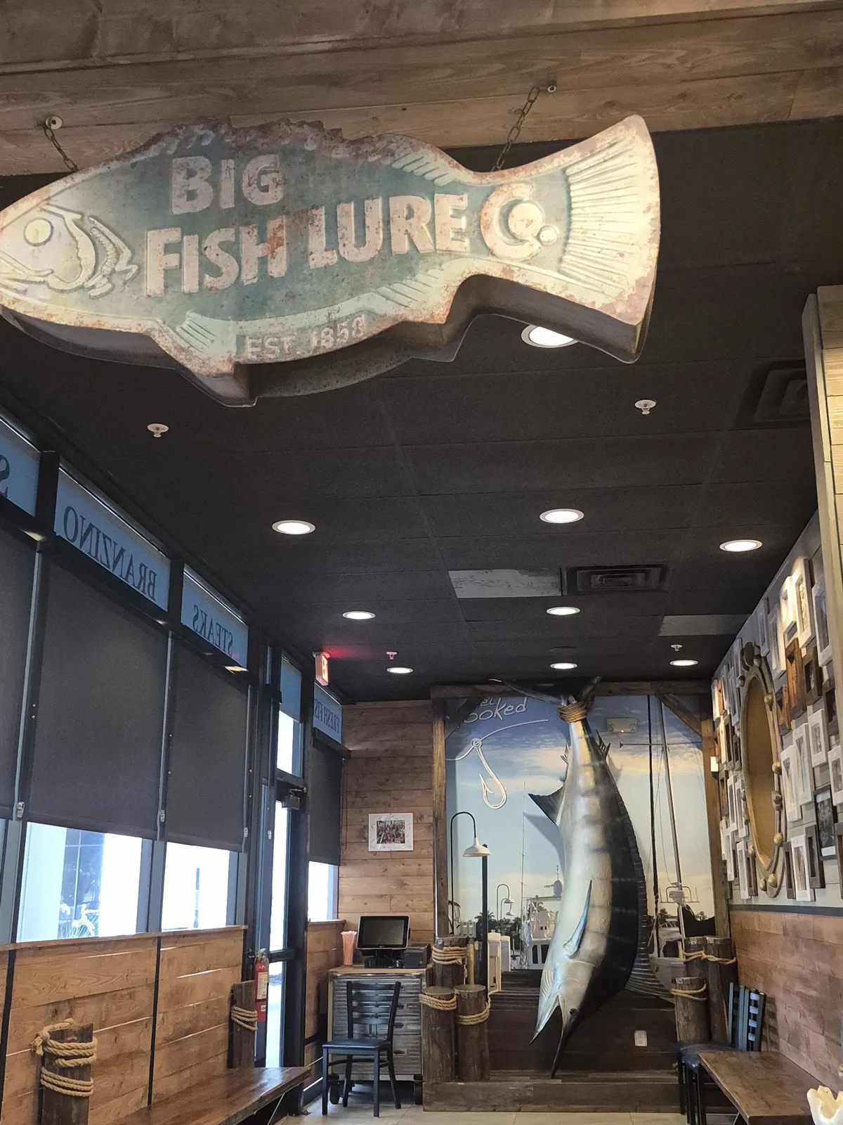 Inside Mr. Big Fish with the Big Fish Lure Co. sign and a mounted fish