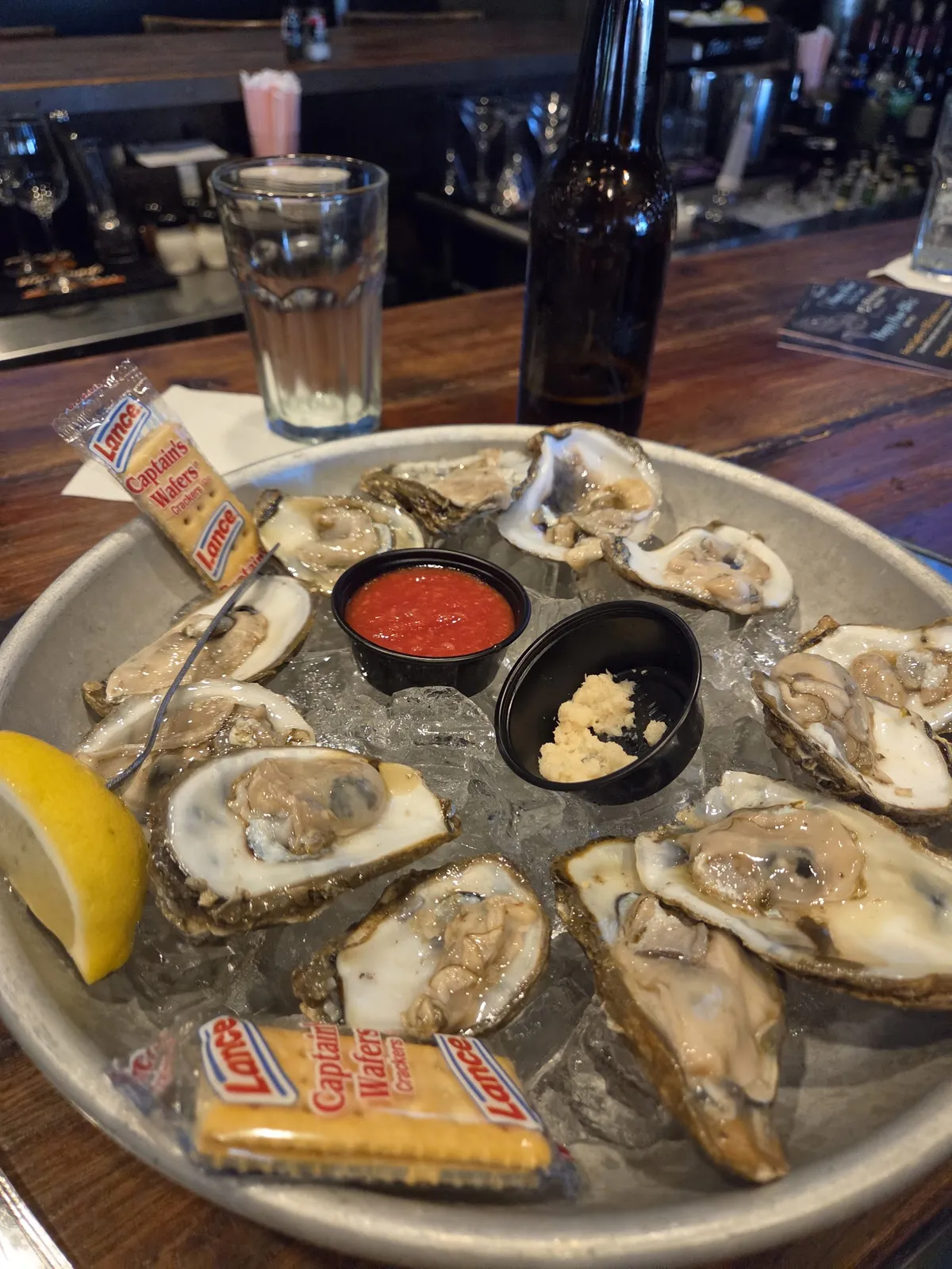 A platter of fresh oysters on ice